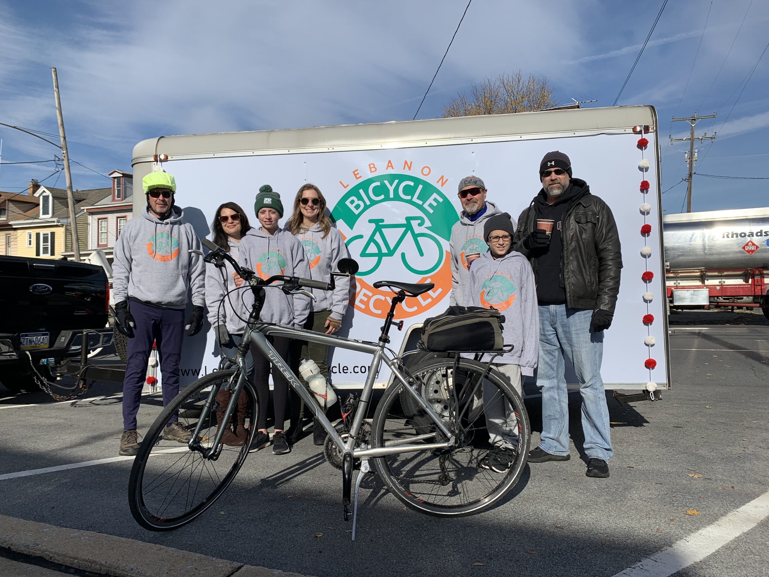 Lebanon Bicycle Recycle team pictured with program trailer and a bicycle